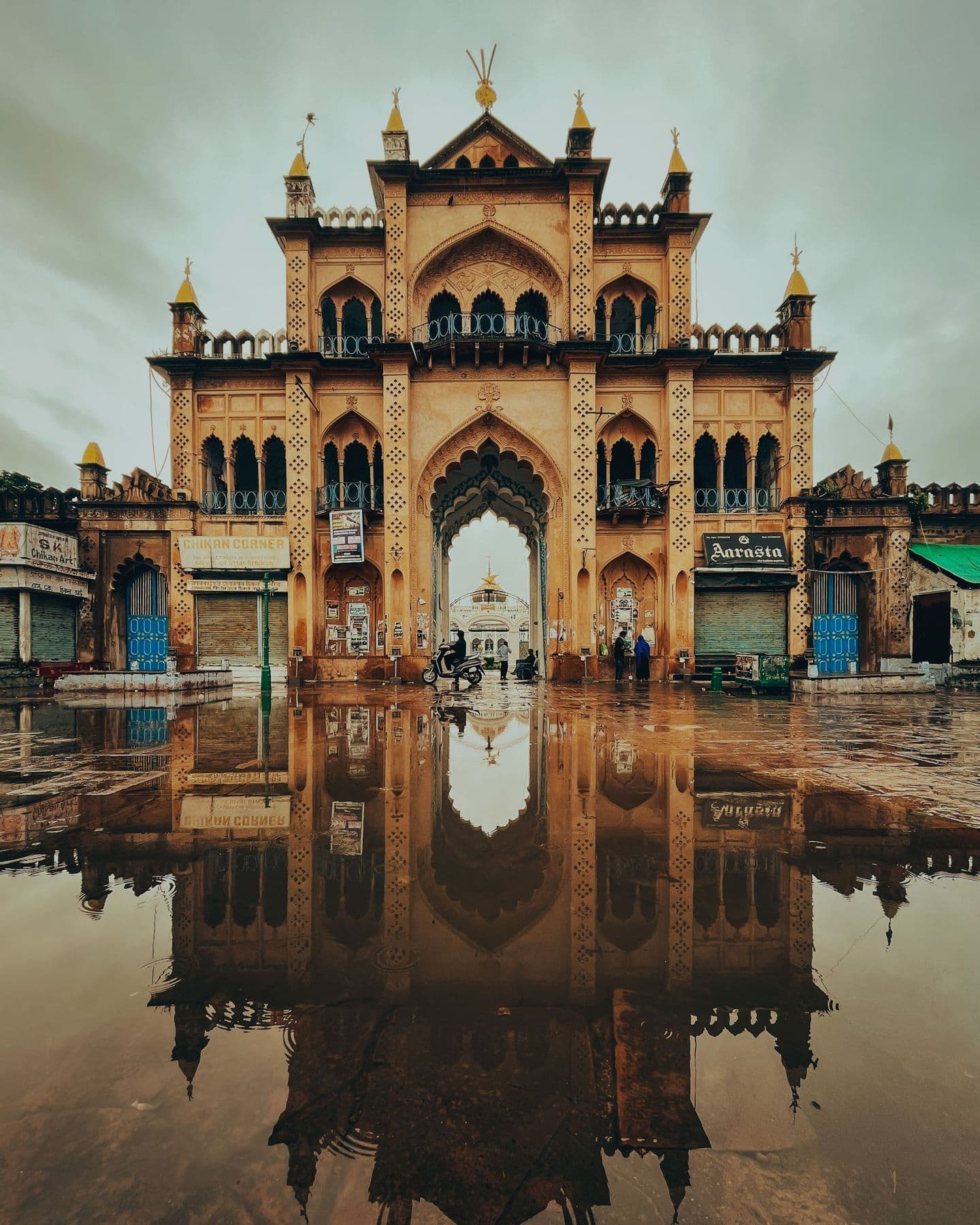 Chhota Imambara gateway reflected in rainwater, Lucknow