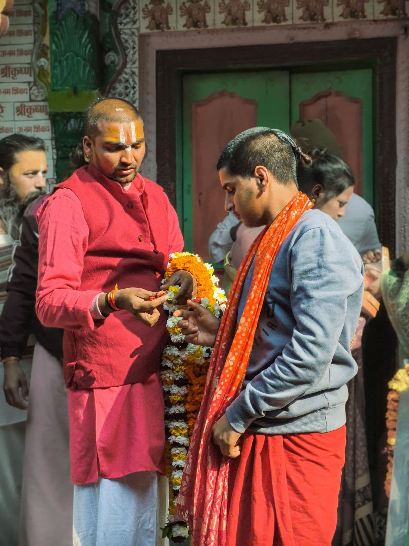 Priests exchanging marigold garlands in Ayodhya