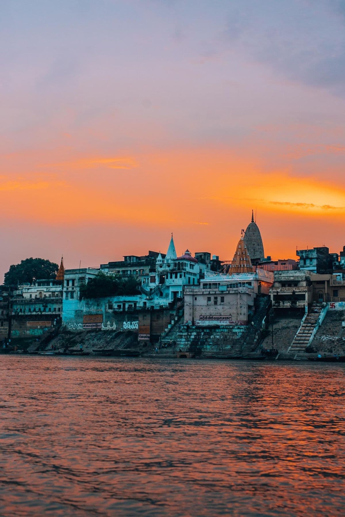 Varanasi ghats and temple spires at sunset over the Ganga
